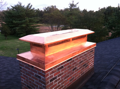 Before and after chimney cap replacement in Albertson, NY