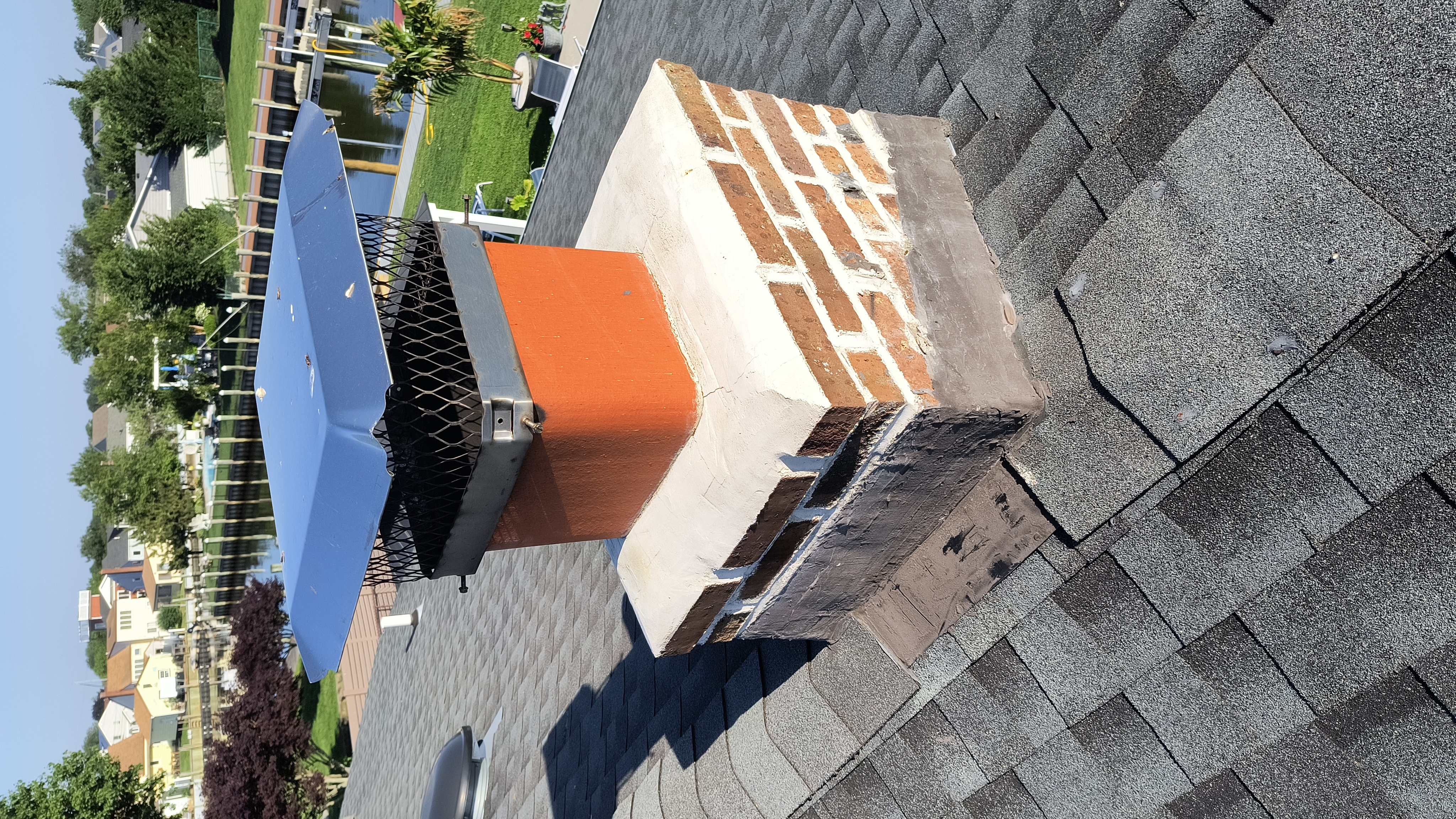 Full chimney masonry rebuild and restoration in Albertson, NY
