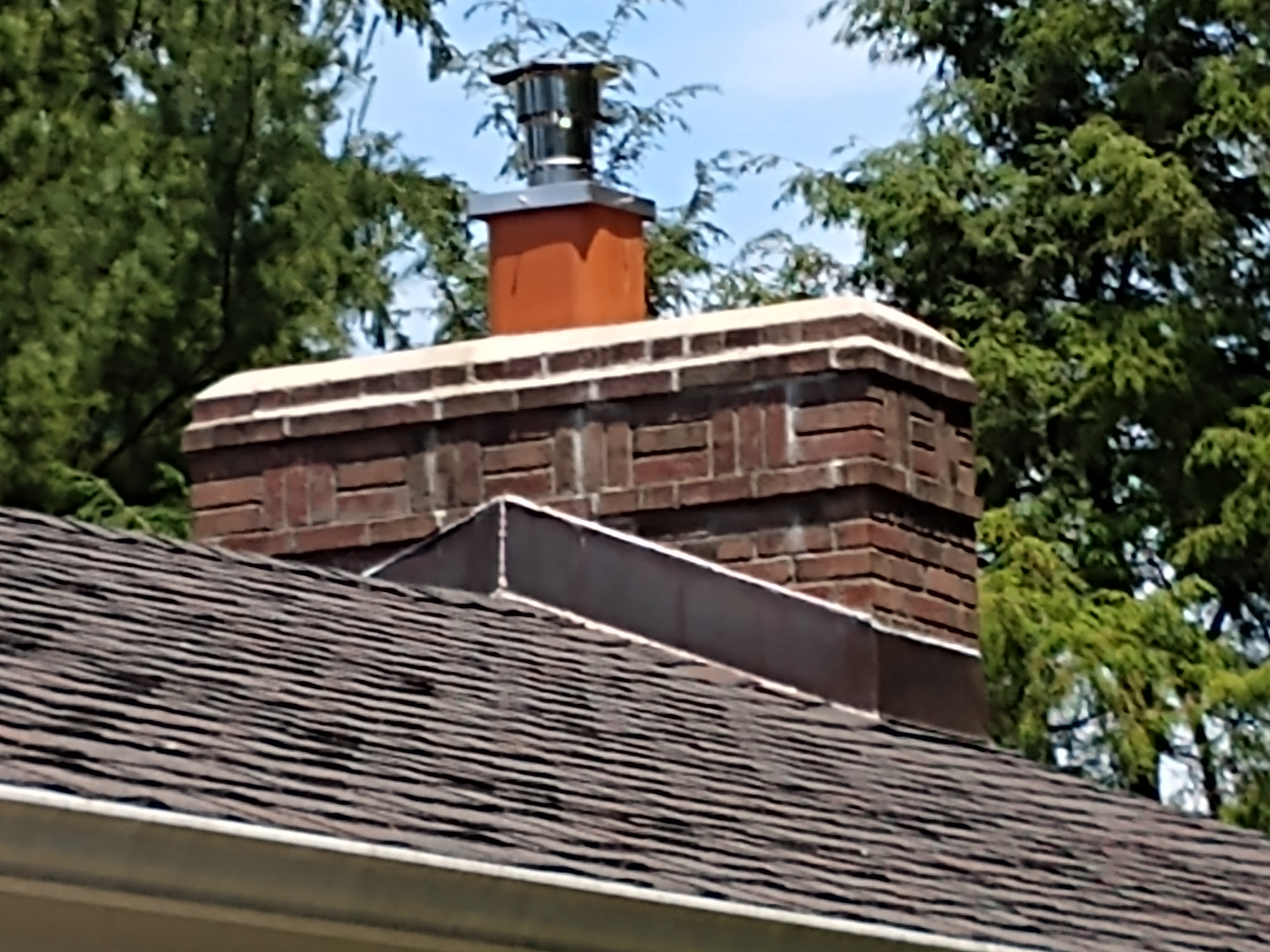 Stainless steel chimney cap with animal guard in Albertson, New York